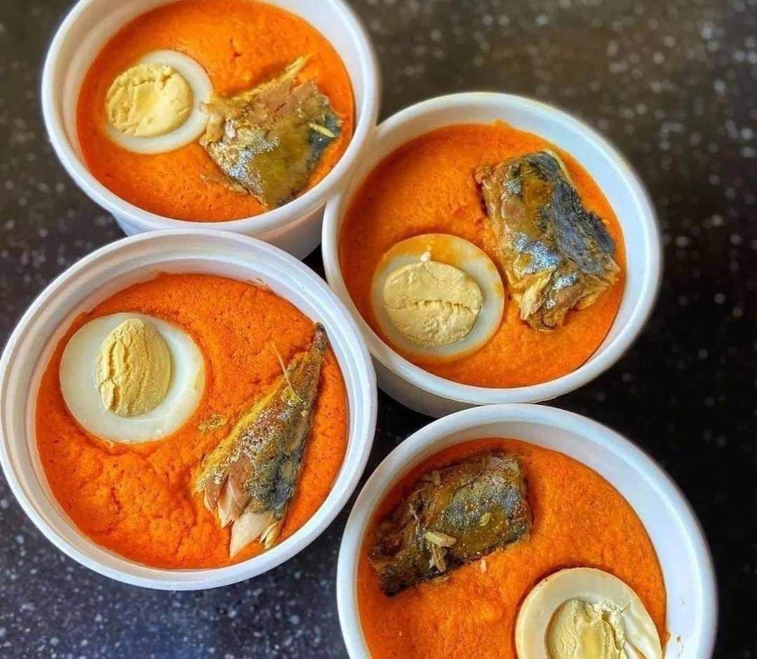 Moin-moin cups topped with egg and mackerel
